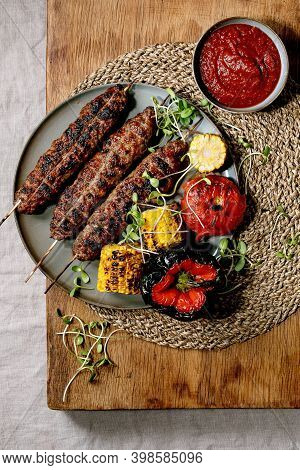 Eastern Fast Food. Grilled Beef Lyulya Kebab On Sticks On Plate With Grilled Vegetables Sweet Corn C