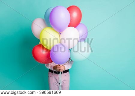 Photo Of Guy Hide Behind Colorful Hellium Balloons Wear Formal Cloth Isolated On Turquoise Color Bac