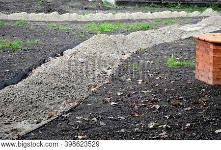Construction Of A Threshing Gravel Sidewalk, Installation Of A Steel Strip As A Curb Path. Between T