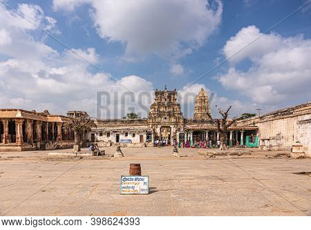 Hampi, Karnataka, India - November 4, 2013: Virupaksha Temple Complex. Wide Courtyard Of Brown Stone