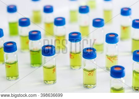 Pattern From Hplc Glass Vials With Green Fluid. Pharmaceuticals And Chemical Analysis.