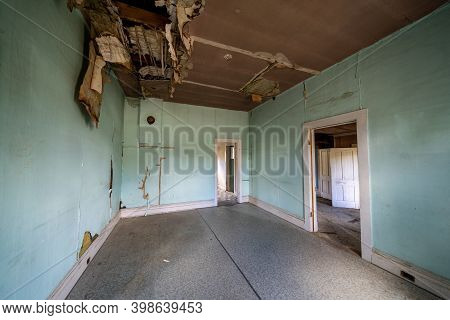 The Rotting And Decaying Interior Of An Old Kitchen In An Abandoned Home In Bannack Ghost Town. Ceil
