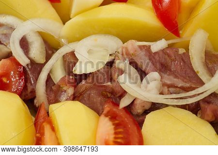 Pork Meat, Potatoes, Tomatoes And Onions, Ready To Bake