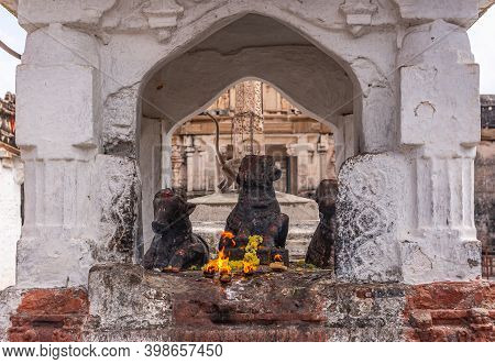 Hampi, Karnataka, India - November 4, 2013: Virupaksha Temple Complex. Closeup Of 3 Nandi Statue In 