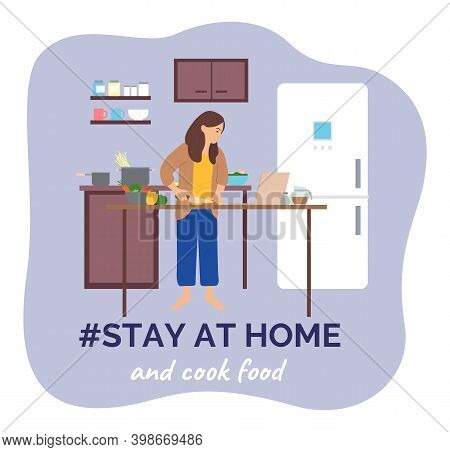 Self Isolation, Stay At Home Concept, Young Woman Cooking In The Kitchen Using Laptop Surfing Intern