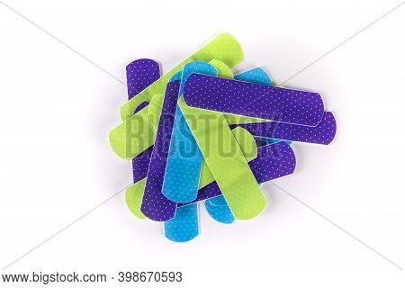 Pile Of Multicolored Green Purple Blue Bandage Strips Top Down View