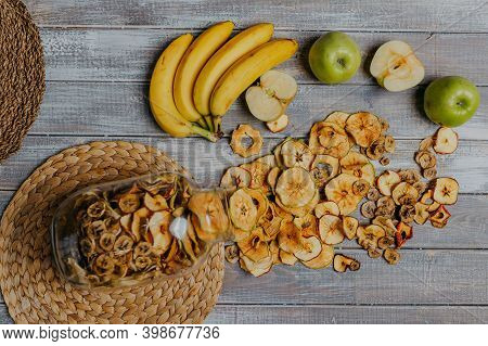 Apple Fruit Chips In The Jar With Fresh Fruits On The Wooden Table. Chips For Fruit Leather. Healthy