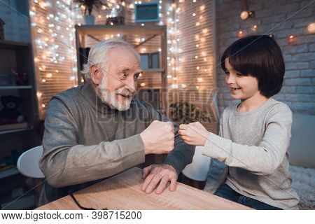 Frustrated Father In Suit Sits On Couch Next To Young Wife And Daughter. A Man Sits In A Suit And Lo