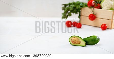 Fresh Avocado On White Table With Space For Text.
