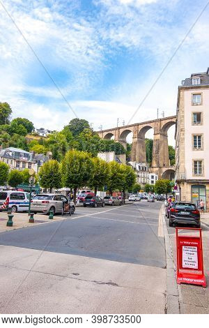 Morlaix, France - August 28, 2019: Street In The Historical Center Of Morlaix With Its Viaduct In Th