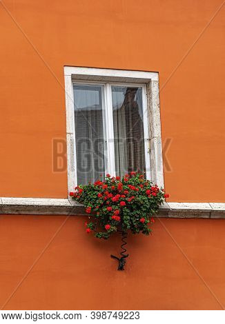 White Window With Flowers On The Windowsill.