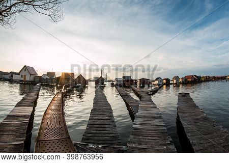 A Picture From Hungary, From A Place Called Bokod. The Local People Have The Wooden Cottages On Pylo