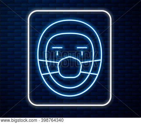 Glowing Neon Line Doctor Pathologist Icon Isolated On Brick Wall Background. Vector