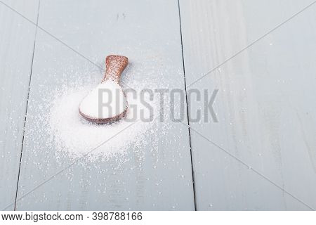 Studio Lighting. Retro Style Wooden Background. Sugar. Close-up.