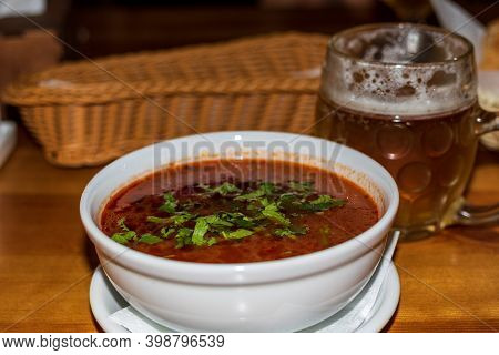 Georgian Traditional Food Soup Kharcho On Rustic Wooden Table. Spicy Lamb And Rice Soup.