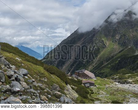 Summer View Of Sulzenau Mountain Hut, Sulzenauhutte With Resting Tourist People. Alpine In Mountain 
