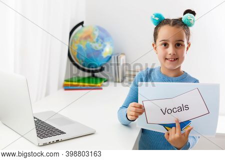 Little Girl At Speech Therapist Office, Little Girl Learns Vocal On Laptop Online, Distance Learning