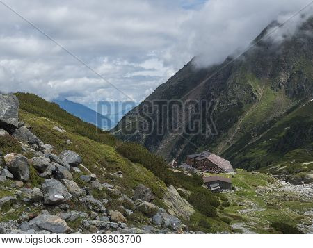 Summer View Of Sulzenau Mountain Hut, Sulzenauhutte With Resting Tourist People. Alpine In Mountain 