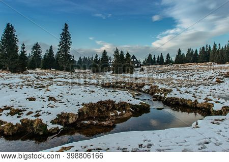 Winter View Of Mountain Landscape, Fresh Cold Stream And Large Meadow At Jizerka Settlement,czech Re