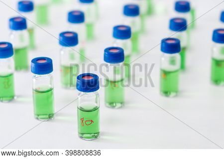 Pattern From Hplc Glass Vials With Green Fluid. Pharmaceuticals And Chemical Analysis.