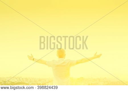 Back View Man Overlooking Sunset City With Hands Rised Up To Sky, Feeling And Celebrating Freedom, V