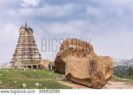 Hampi, Karnataka, India - November 4, 2013: Virupaksha Temple East Gopuram Under Blue Cloudscape, Wi