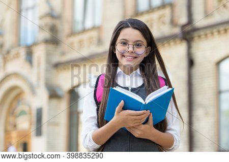 Be A Reader. Happy Kid Hold Library Book Outdoors. School Library. Reading And Literacy Education. B