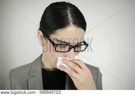 Young Woman In Glasses With Symptoms Of Malaise And Nausea.