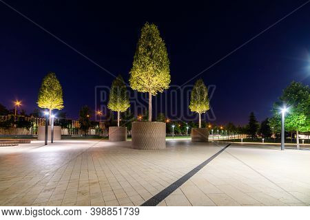 Maple Alley In French Garden In Public Landscape City Park Krasnodar Or Galitsky Park . Wooden Circu