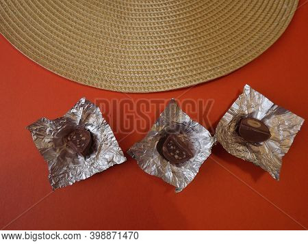 Individual Silver Wrapped Chocolates With Different Fillings In A Box. High Quality Photo