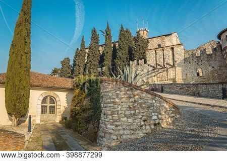 Brescia, Italy - December, 2015: The Castle Of The City Of Brescia On A Sunny Clear Day Against A Br