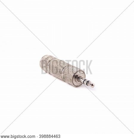 Metal Audio Jack To Mini Jack Adapter, Isolated On White Background. Close Up