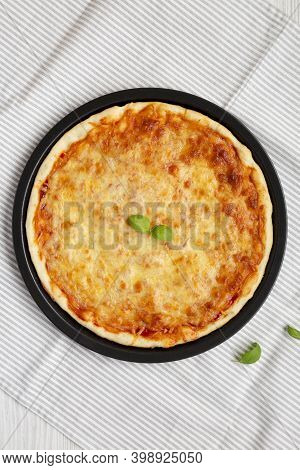 Homemade Neopolitan Pizza With Cheese And Basil, Overhead View. Flat Lay, From Above, Top View.