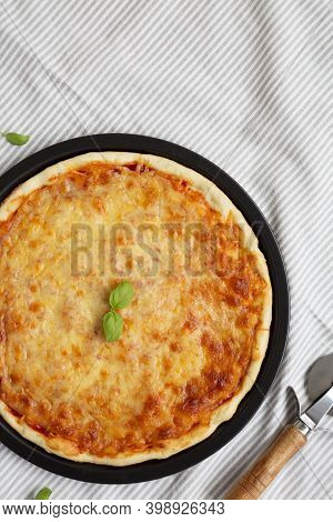 Homemade Neopolitan Pizza With Cheese And Basil, Top View. Flat Lay, Overhead, From Above.