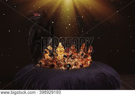 Fantasy World. Black Crow Lit By Magic Light Sitting On Golden Crown