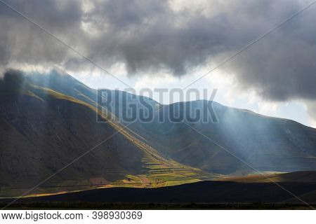 Dramatic mountain landscape near Castelluccio village in National Park Monte Sibillini, Umbria region, Italy
