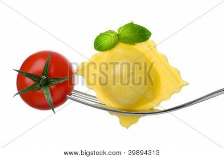 Ravioli Pasta Tomato And Basil On Fork Against White Background