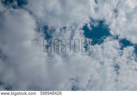 Abstract Cloudy Sky Background With Blue Sky Between Clouds