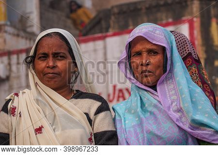 Varanasi, India - Dec 23, 2019: Unidentified Indian Women With Her Colorful Scarf. Scarf Made Of Ind