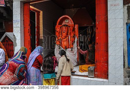 Varanasi, India - Dec 24, 2019: Unidentified Indian Women With Her Colorful Scarf. Scarf Made Of Ind