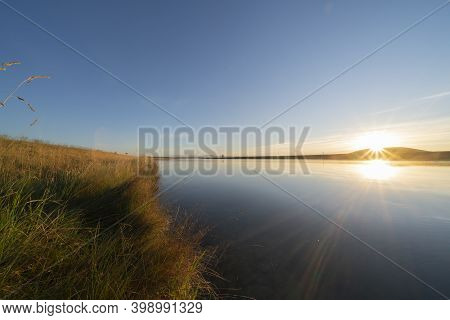Still Morning At Sunrise Along Ohau Canal Just Outside Twizel In Canterbury Region Of New Zealand.