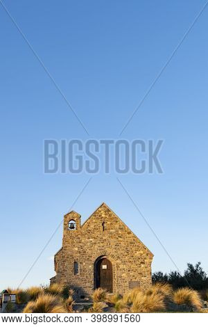Sun Sets On Stone Front Of Church Of Good Sheppard In Tekapo., Canterbury New Zealand.