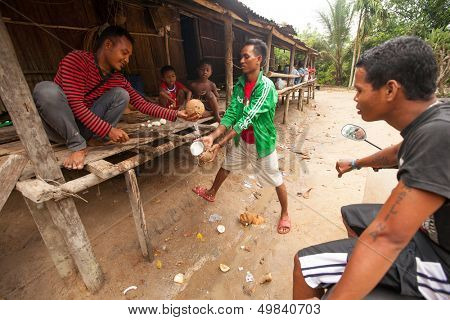 BERDUT, MALAYSIA - APR 8: Unidentified people Orang Asli in his village on Apr 8, 2013 in Berdut, Malaysia. More than 76% of all Orang Asli live below the poverty line, life expectancy - 53 years old.