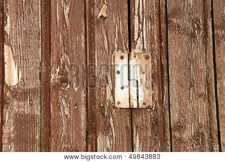 Hinge On A Wooden Background