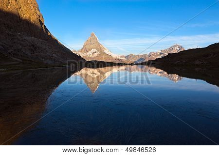 Matterhorn reflecton in Riffelsee after sunset, Zermatt, Alps Switzerland