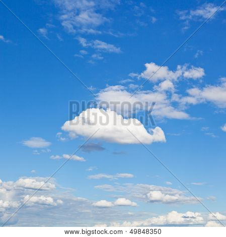 White Clouds In Blue Sky In Summer Day