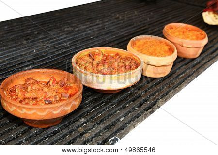 Food Is Served In Ceramic Pots