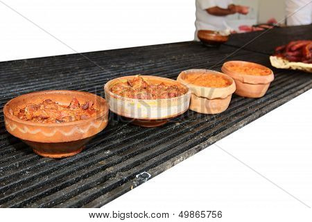 Food Is Served In Ceramic Pots