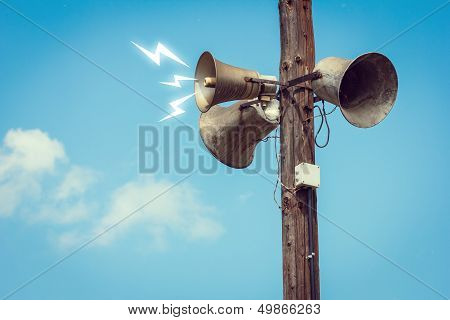 Wooden Pole With Three Speakers