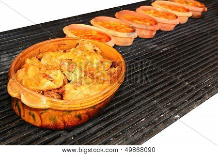 Food Is Served In Ceramic Pots